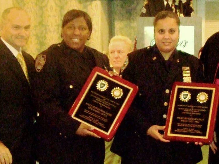 2 women with thier certificates