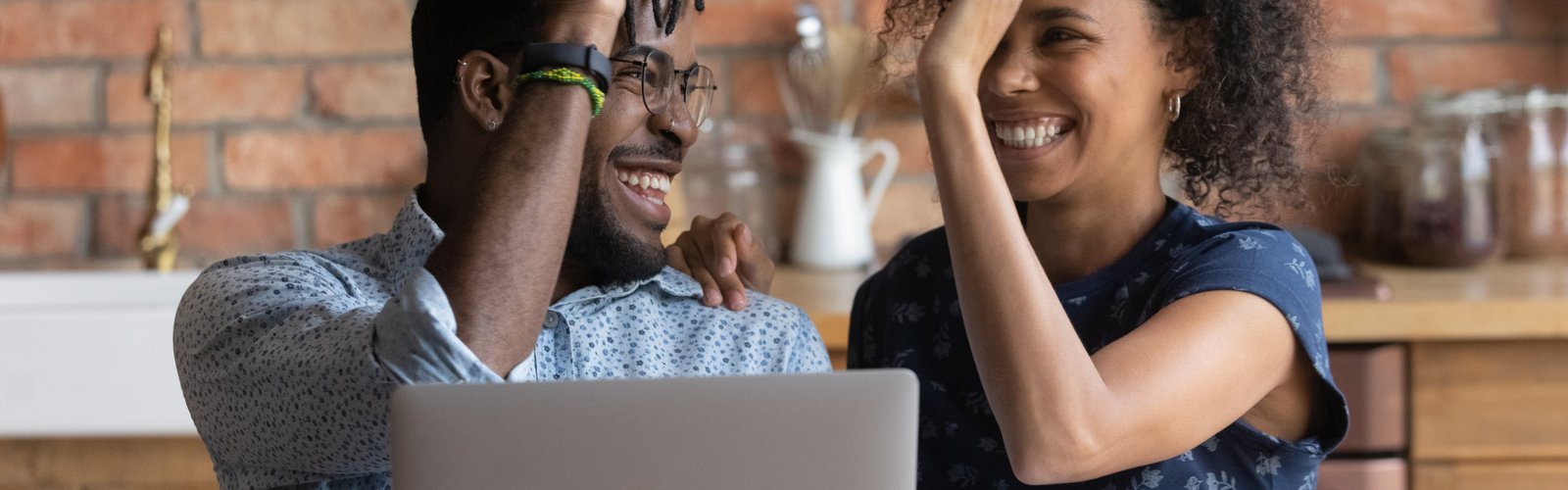 young couple giving each other a high five